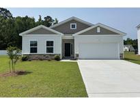 Charming single-story home with a well-manicured lawn and attached garage at 331 Garden Grove St, Conway, SC 29526