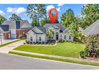 Beautiful single-story home with manicured lawn and white brick exterior at 3736 Kingsley Dr., Myrtle Beach, SC 29588