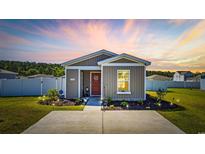 Charming single-story home featuring landscaped yard, concrete driveway, and neutral exterior paint at 924 Akron St., Conway, SC 29526