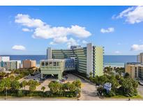 Beautiful resort with stunning ocean views, featuring a covered entrance, lush landscaping and convenient parking at 1105 S Ocean Blvd. # 110, Myrtle Beach, SC 29577