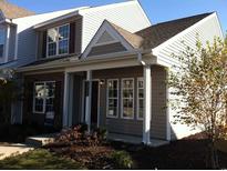 Inviting home with a cozy front porch, manicured lawn, and charming architectural details at 3017 Mercer Dr. # 0, Conway, SC 29526