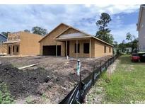 New construction home featuring a covered entry and an attached two-car garage at 3072 Palma Way, Myrtle Beach, SC 29579