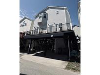 Coastal home featuring elevated construction, a spacious deck, and classic beach architecture at 6001-1168 S Kings Hwy., Myrtle Beach, SC 29575