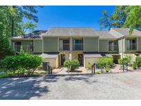 Charming multi-Gathering home featuring a balcony, landscaped front yard, and convenient parking space at 1 Gate 1 # 1, Carolina Shores, NC 28467
