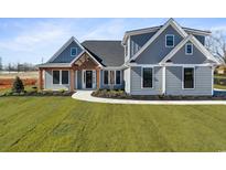 Beautiful single Gathering home showcasing impeccable landscaping and craftsman style architecture at 2729 Long Avenue Ext., Conway, SC 29526