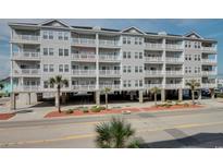 Spacious beachside condo with large balconies, covered parking, and lush landscaping at 3401 N Ocean Blvd. # 302, North Myrtle Beach, SC 29582