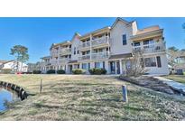 Inviting condo complex boasting multiple balconies overlooking lush grounds and waterway access at 510 Fairwood Lakes Dr. # 18N, Myrtle Beach, SC 29577