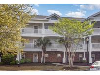 Condo exterior features multiple balconies, brick accents, and well maintained landscaping at 6015 Catalina Dr. # 134, North Myrtle Beach, SC 29582