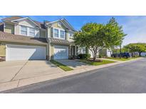 Charming townhome with attached garage and lush green lawn in a desirable community at 6172 Catalina Dr. # 612, North Myrtle Beach, SC 29582