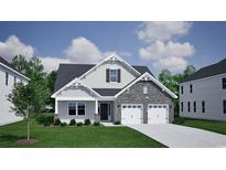 Charming two-story home with stone accents, attached two-car garage, and manicured lawn at 1095 Laconic Dr., Myrtle Beach, SC 29588