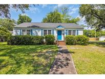 Charming single story home with blue door, blue shutters and well-maintained front yard at 1155 Palmetto St., Georgetown, SC 29440