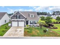 Charming two-story home with a two-car garage, stone accents, and a landscaped front yard at 116 Glengrove Lane, Murrells Inlet, SC 29576