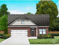 Charming single-story home featuring a brick facade, attached garage, and well-manicured lawn at 118 Westfield Circle, Conway, SC 29526