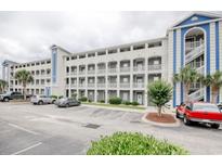 Condo building with multiple stories, balconies, and parking in front at 121 Waypoint Ridge Ave. # P-15, Little River, SC 29566