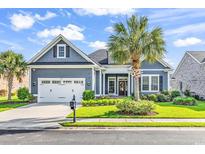 Charming single-Gathering home featuring a well-manicured lawn and a two-car garage, perfect for suburban living at 1210 East Isle Of Palms Ave., Myrtle Beach, SC 29579