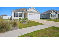 Charming single-Gathering home with well-manicured lawn and an attached two-car garage at 1723 Perthshire Loop, Myrtle Beach, SC 29579