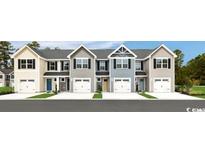 New townhomes featuring various colors, one-car garages, and traditional architectural details at 3210 Nw Edgemead Circle # C, Calabash, NC 28467