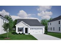 Charming single-story home with a symmetrical facade, attached two-car garage, and well-maintained lawn at 3432 Logan St., Conway, SC 29526