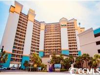 Exterior shot of condo building with beach access and ocean views at 4800 S Ocean Blvd. # 1221, North Myrtle Beach, SC 29582