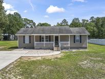 Charming single-story home with a cozy front porch and well-maintained lawn at 568 Rosedale Dr., Aynor, SC 29511