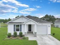 Charming single-story home with white siding, manicured lawn, and inviting front entrance at 182 Foxford Dr., Conway, SC 29526