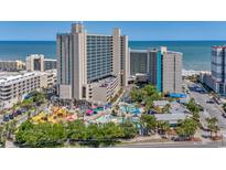Gorgeous aerial view of the resort, showcasing the waterpark and nearby beach at 201 74Th Ave. N # 2243/2244, Myrtle Beach, SC 29572