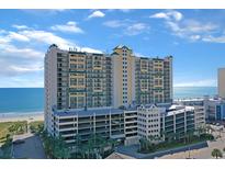 Spacious oceanfront condo building with beach access and multi-level parking garage at 201 S Ocean Blvd. # 1106, North Myrtle Beach, SC 29582