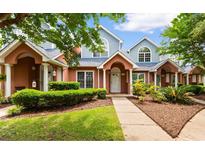 Charming two-story townhomes with a beautifully landscaped front yard and inviting entrance at 4505 Lightkeepers Way # 24B, Little River, SC 29566