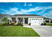 Charming single-story home with well-manicured lawn and inviting front porch at 9675 Holladay Dr., Murrells Inlet, SC 29576