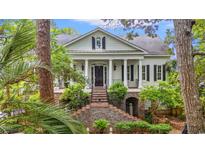 Stately home with white columns, black shutters and a brick staircase leading to the front entrance at 1080 Waterway Ln., Myrtle Beach, SC 29572