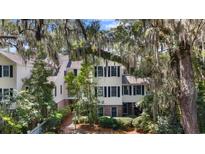 Charming home with black shutters, brick accents, and lush green landscaping at 1969 Governors Landing Rd. # 224, Murrells Inlet, SC 29576