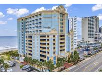 Beautiful multi-story condo with a parking garage, ocean views, and palm trees at 2501 S Ocean Blvd. # 111, Myrtle Beach, SC 29577