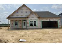 Exterior view of new home construction with gray roof, white trim, and an attached two-car garage at 123 Westfield Circle, Conway, SC 29526