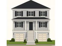 Charming two-story home with a covered porch and two-car garage and dark shutters at 1313 Waterway Dr., North Myrtle Beach, SC 29582