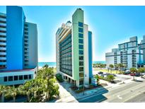 Bright exterior of a condo building with balconies and ocean views at 2310 N Ocean Blvd. # 1107, Myrtle Beach, SC 29577