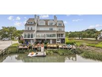 Beautiful waterfront home featuring multiple decks, an outdoor seating area and a private dock at 465 Vereen Rd. # 10, Murrells Inlet, SC 29576