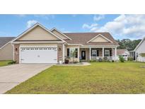 Charming single-story home with a well-maintained lawn, attached garage, and inviting front porch at 716 Weston Dr., Conway, SC 29526