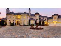 Stunning, multi-story home featuring a circular driveway with fountain and meticulous landscaping at 2715 Ships Wheel Dr., North Myrtle Beach, SC 29582