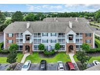 Beautiful condominium building features well-manicured landscaping and ample parking at 3795 Hitchcock Way # 613, Myrtle Beach, SC 29577