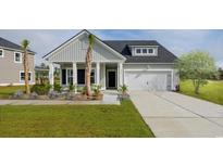 Charming one-story home with a well-manicured lawn, beautiful landscaping, and an attached two-car garage at 5051 Selene Ct., Myrtle Beach, SC 29588