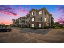 Inviting condo complex showcases brick and siding details, manicured landscaping and convenient parking at 730 Pickering Dr. # 303, Murrells Inlet, SC 29576