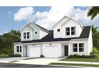 An inviting view of new two-story paired homes, each with an attached garage and lovely curb appeal at 1712 Hunting Harris Ct # 3, Ocean Isle Beach, NC 28469