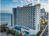 Oceanfront condo building with multiple balconies and a swimming pool overlooking the beach at 1805 Windmere W S Ocean Blvd. # 1109, Myrtle Beach, SC 29575