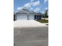 Charming single-story home featuring a two-car garage and a beautifully landscaped front yard at 236 Broughton Dr., Myrtle Beach, SC 29579