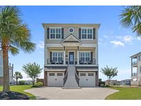 Beautiful two-story home with double garage, a front staircase, and dual balconies at 397 St. Julian Ln., Myrtle Beach, SC 29579