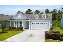 Charming single-Gathering home featuring a well-manicured lawn and a two-car garage at 4555 Weekly Dr, Myrtle Beach, SC 29579
