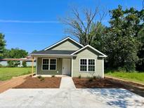 Charming single story home with a bright yard and concrete driveway at 608 Miles Ct, Marion, SC 29571