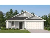 Charming single story home with gray siding, black door, an attached two car garage, and neatly manicured lawn at 1218 Willow Oaks Way, Conway, SC 29526