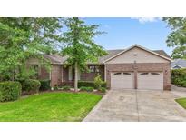 Beautiful brick home with a well-manicured lawn and a two-car garage, offering classic curb appeal at 1468 Fox Hollow Way, North Myrtle Beach, SC 29582