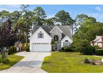 Charming two-story home boasts a manicured lawn and attached two car garage at 2077 N Berwick Dr., Myrtle Beach, SC 29575